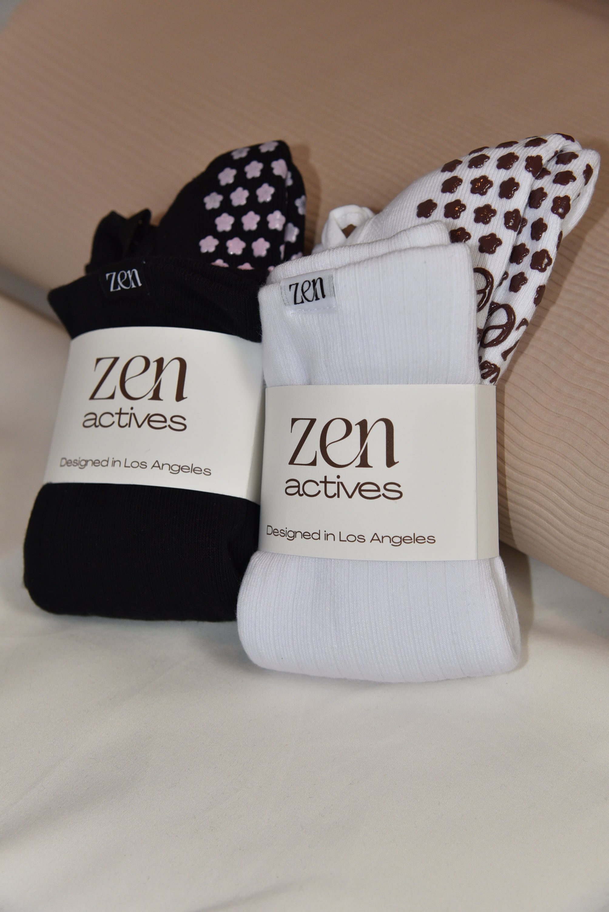 Three pairs of socks with 'zen actives' branding on a light background